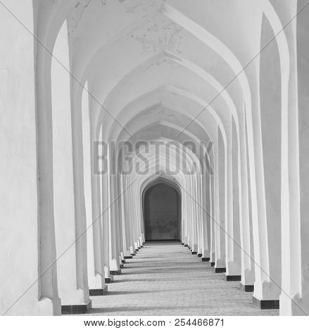 White Arabian arches in Kolon mosque. Bukhara. Uzbekistan. Central Asia.