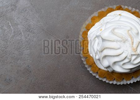 Delicious Merengue Dessert. Lemon Tartlet Tart With With Meringue On Grey Stone Concrete Table Backg