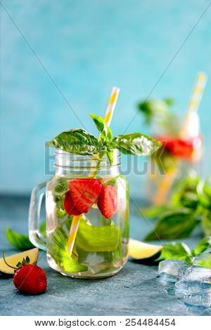 Strawberry And Basil Limeade Or Infused Spa Water In A Glass Jar, Front View, Space For A Text Above