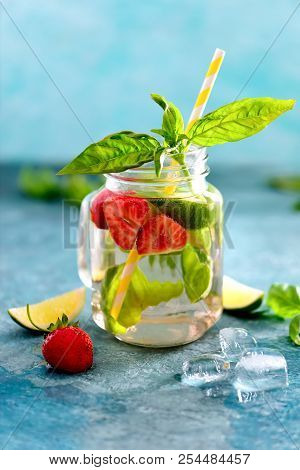 Strawberry And Basil Limeade Or Infused Spa Water In Glass Jar, Front View