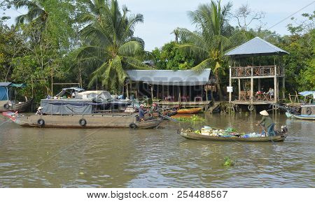 Phong Dien, Vietnam - December 31st 2017. Two Market Vendors In Their Boats At The Phong Dien Floati