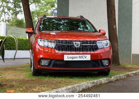 A Dacia Model Logan Mcv Car In Red Color At The Gijón Exhibition Fair 2018. Image Taken On August 16