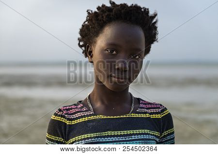 Orango Island, Guinea-bissau - February 2, 2018:  Portrait Of A Beautiful Young Girl At The Beach In