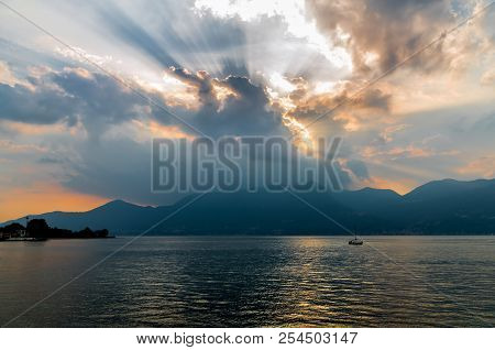 Golden Sunset Before The Storm Over The Lake Maggiore In Luino, Italy
