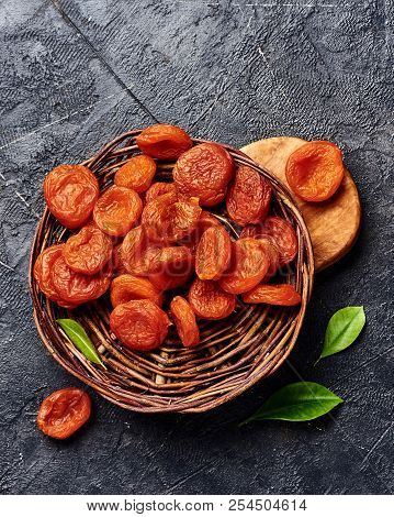 Dried Apricots On Gray Background. Top View.