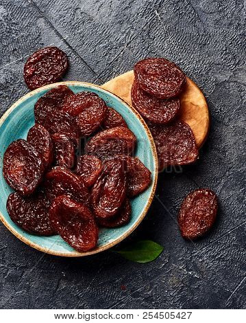 Dried Brown Apricots On Gray Background. Top View.