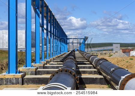 Industrial Pipeline That Goes Into Perspective To The Above-ground Structures Of The Modern Mine