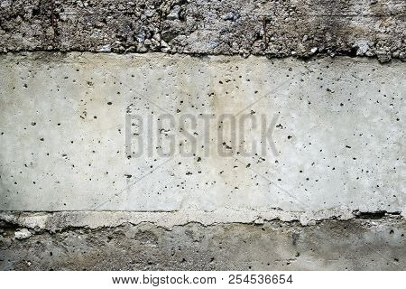 Layered Concrete Surface With Gravel Stones In The Layers