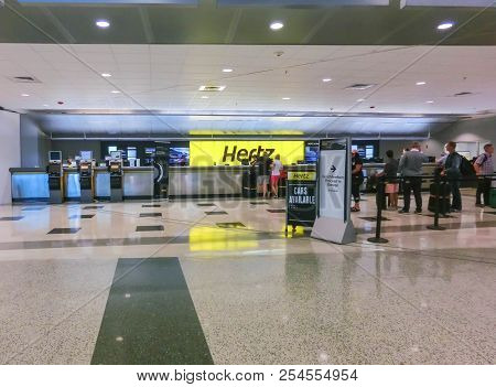 Miami, Florida, Usa - Aprile 28, 2018: The People Near Hertz Rental Car Office At Miami Airport At M