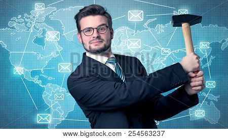 Businessman holding tool with global map graphic on the background