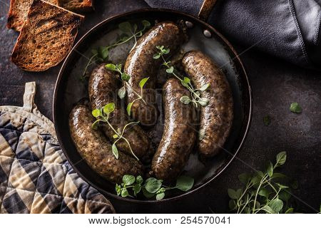 Roasted Sausages In Pan With Bread And Herbs.