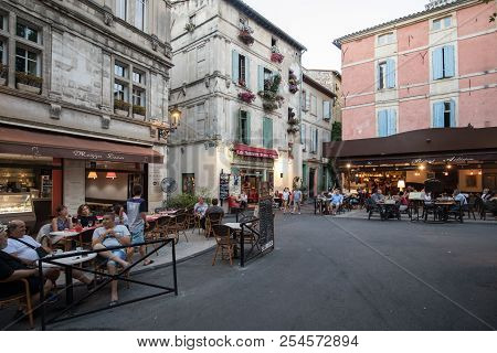 Arles, France - June 24, 2017: People Sitting At A Cafe In Place Du Forum, Arles, Provence, France.