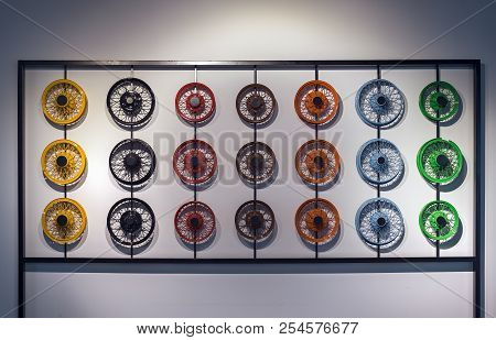 Old Style Car Wheels Mounted On Wall Bracket
