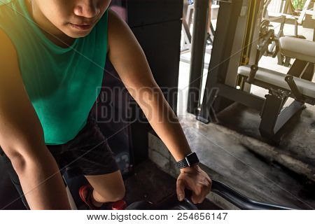 Asian Man Bodybuilder With Bicycle Machine Weights Power Handsome