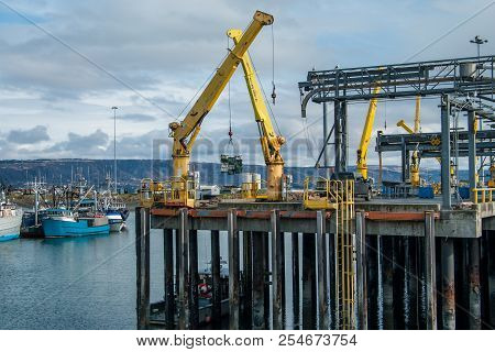 Alaska Shipping Dock:  Large Cranes Move Cargo At A Dock In Homer, Alaska.