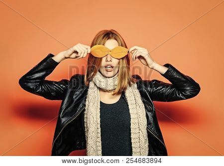 Season And Autumn Holiday. Beauty And Fashion. Girl With Orange Leaves. Woman With Autumn Leaves As 