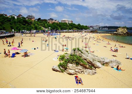 Santander,Spain - July 20, 2018: El Sardinero waterfront promenade and surfer beach. El Sardinero is a popular beach located in the Spanish city of Santander, Cantabria