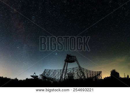 The Group Of Antennas Of The Station Of Exploration Of An Ionosphere. A Silhouette Against The Backg