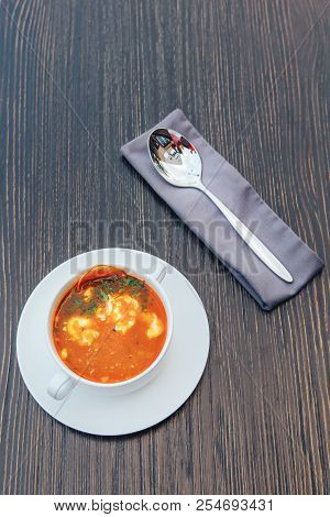 Traditional Russian Solyanka With Cream On A Wooden Table. Solyanka Soup With Cream.