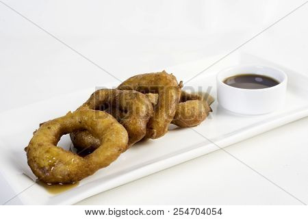 Picarones: These Are Ring-shaped Dessert Made With Wheat Flour Dough Mixed With Pumpkin And Sweet Po