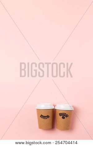Two Craft Cups To Do On The Pastel Pink Background. Decorated With Funny Cute Paper Eyes. Wake Up An