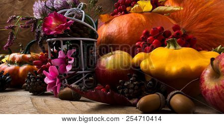 Fall Decor With Yellow And Orange Squash And Acorn