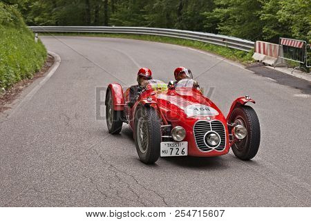Passo Della Futa (fi) Italy - May 18, 2013: Driver And Navigator On A Classic Racing Car Maserati A6