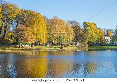 Pond In Riga, District Agenskalsns. Autumn, Yellow Tree Leaves, Lake And Reflection. 2017