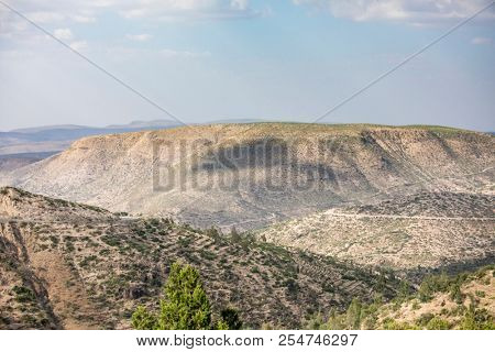 Low aerial view of the desert and mountains of Eastern Ethiopia near Somalia and the city of Harar.