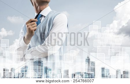 Double Exposure Of Confident And Young Businessman In Smart-casual Wear Smoking Pipe And Modern City