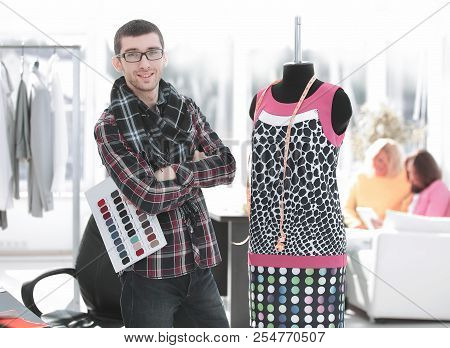 Creative Fashion Designer Standing In His Studio