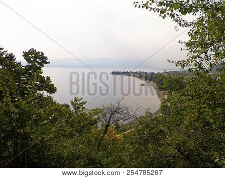 Coast Of Lake Ohrid And Ohrid City. Ohrid Is The Oldest Lake In Europe, Known Of Its, Clean, Transpa