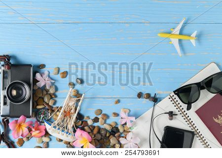 Accessories For Travel On Blue Wood Background