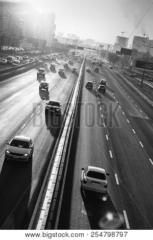 Cars On Highway. Sunset Cityscape. Contrejour Wallpaper