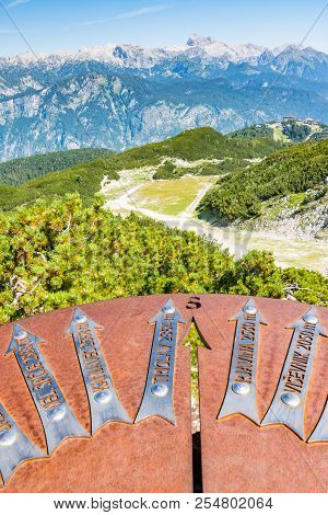 Triglav Metal Arrows With Direction For Tourist. View Of Triglav Mountain From Vogel.