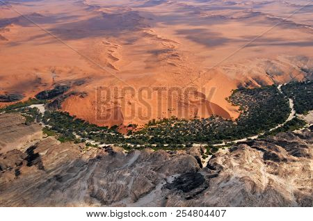 Aerial View On The Beautiful Landscape Of The Kuiseb Canyon In Namib Desert At Sunset. Flying On A S