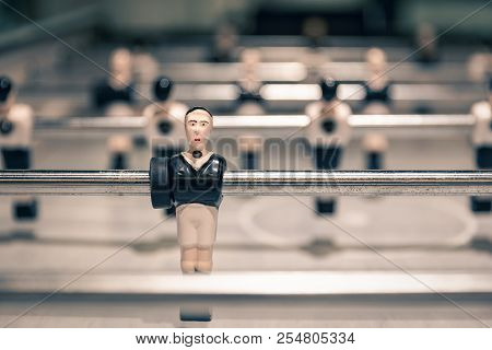 Closeup Scene On Black Shirt Player Doll In Attack Row Rod Ready Before Game Start Of Vintage Table 