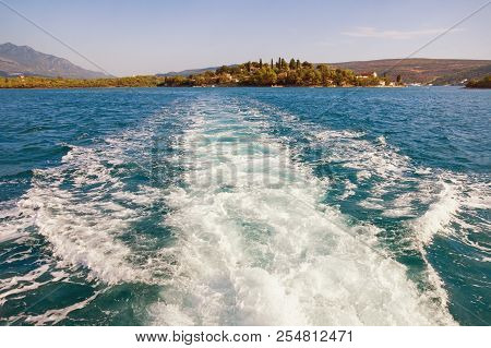 Mediterranean Landscape With Wave Pattern On The Water Surface Behind Boat. Montenegro, Bay Of Kotor