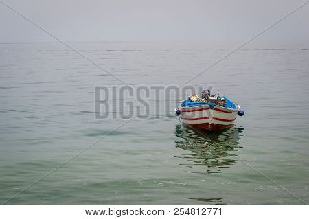 Boat Harbor And Waves And Rocks