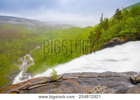 View Of Green Mountain From Valnesforsen Waterfall In Norway