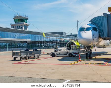 Riga, Latvia - July 8, 2018: Airbaltic airlines airplane boarding at the domestic airport at day time
