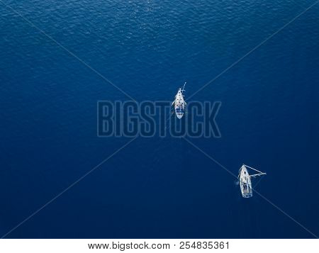 Amasing Aerial View To Two Yachts In Deep Blue Sea. Drone Photography