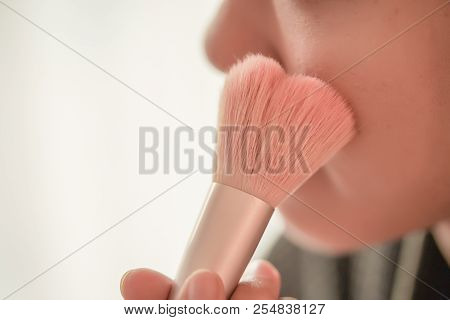 Pretty Girl Is Applying Blush On Cheek By Brush. Beauty Makeup.