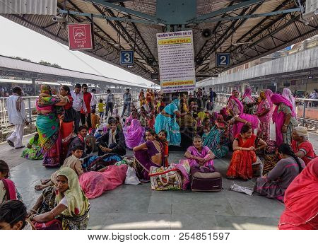 People Waiting At Railway Station