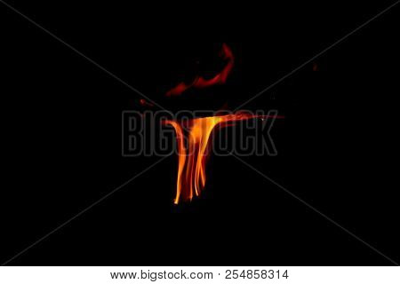 A Dancing Fire In A Fireplace On A Black Background, A Fire Texture, A Red Flame.