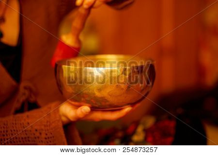 Spiritual Girl Immersed In Meditative Sounds Of Tibetian Bowl.