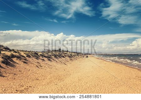 Seascape Of Long Sandy Beach With Sand Dunes In Guardamar Del Segura, Alicante. Spain