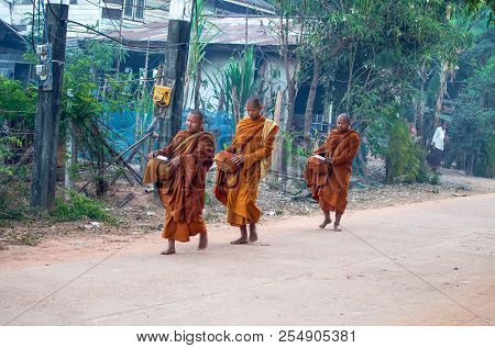 Sakon Nakhon, Thailand, February, 15, 2017 - Monks Walk In The Early Morning In The Isan Village In 