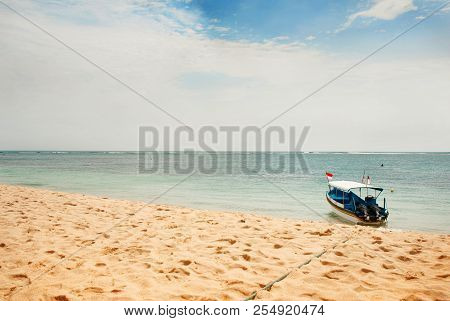 Serene Seascape, Sandy Beach On The Ocean. Relax On The Beaches Of The Island Of Bali. Traditional B