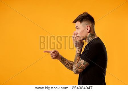 Secret, Gossip Concept. Young Man Whispering A Secret Behind His Hand. Businessman Isolated On Trend